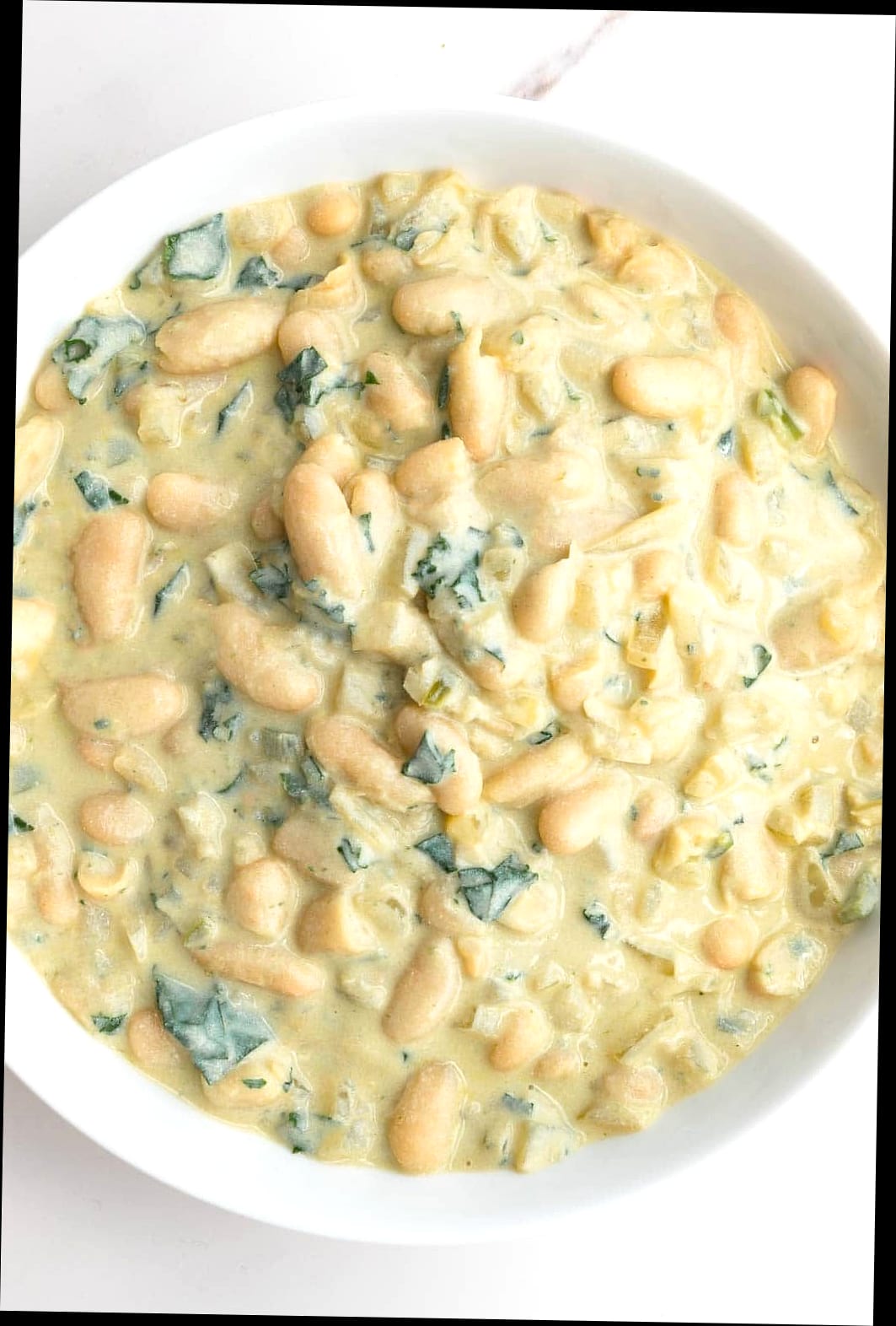 30 High-Protein, Low-Calorie Recipes To Stay On Track Without Boring Meals 11 White Bean and Chicken Soup